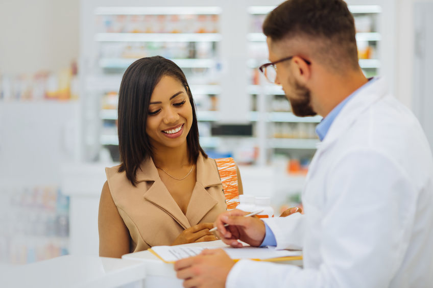 Pharmacist helping a patient at MediServ Pharmacy